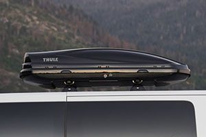 a thule cargo box on top of a van.